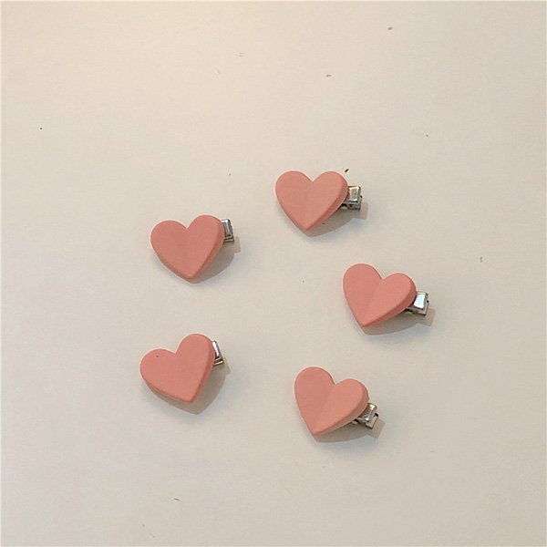 Cute hair clips with kawaii designs including peach, bow, and camellia