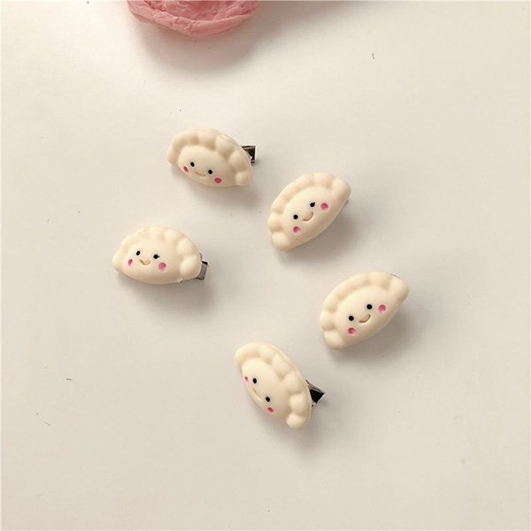 Cute hair clips with kawaii designs including peach, bow, and camellia