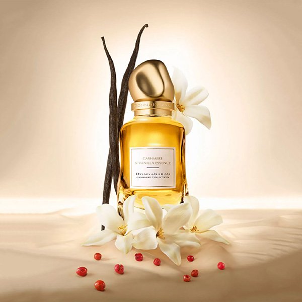 Vanilla Perfume Donna Karan Cashmere & Vanilla Essence bottle with vanilla pods and white flowers
