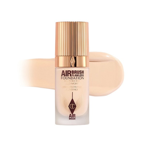 Full Coverage Foundation Charlotte Tilbury Airbrush Flawless bottle with beige swatch