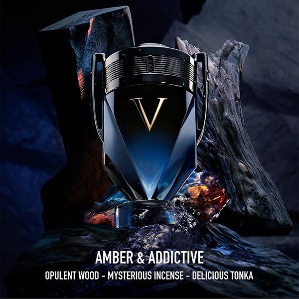 Men's Fragrance Rabanne Invictus Victory Elixir angled view showing blue reflects on black glass