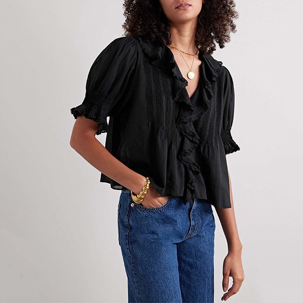 Ruffled Blouse DÔEN Henri black worn by model with straight-leg jeans and gold jewelry
