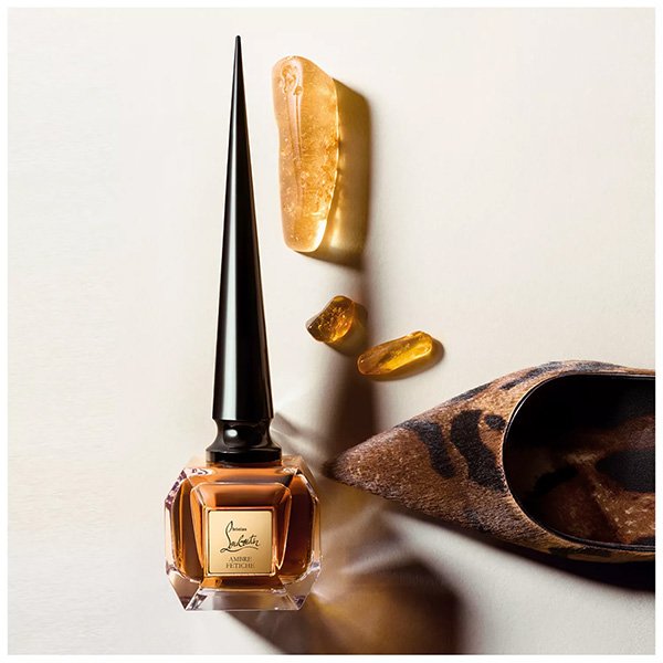 Amber Perfume Christian Louboutin Ambre Fétiche styled with raw amber resin and leopard print heel