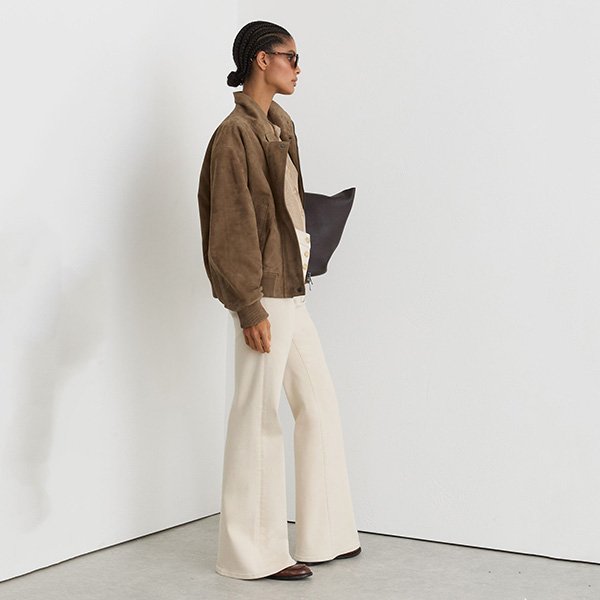 Bomber Jacket REISS Cara Neutral side view on model with cream trousers and brown loafers