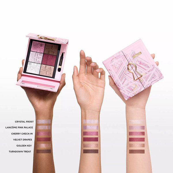 Pink Eyeshadow Palette Lancôme Suite Escape held in hands with swatches on three skin tones