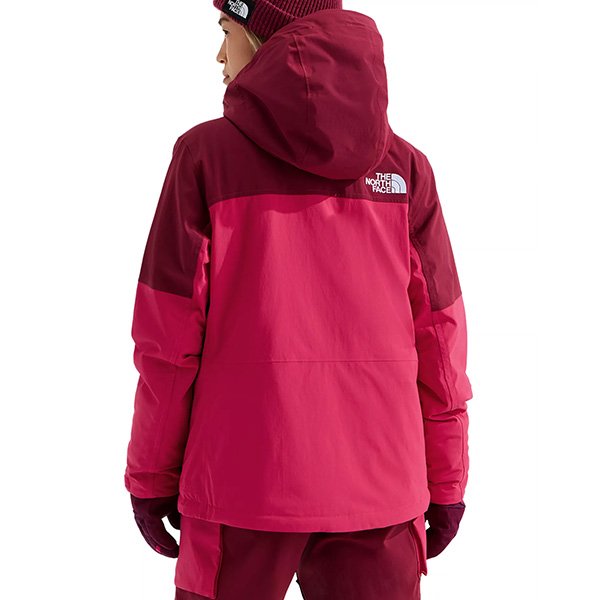 Pink freedom jacket back view showing insulated design and powder skirt